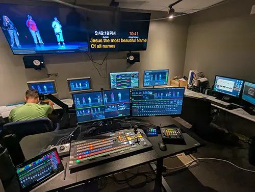 Professional broadcast control room with multiple monitoring displays